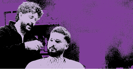 Barber cutting hair with clippers